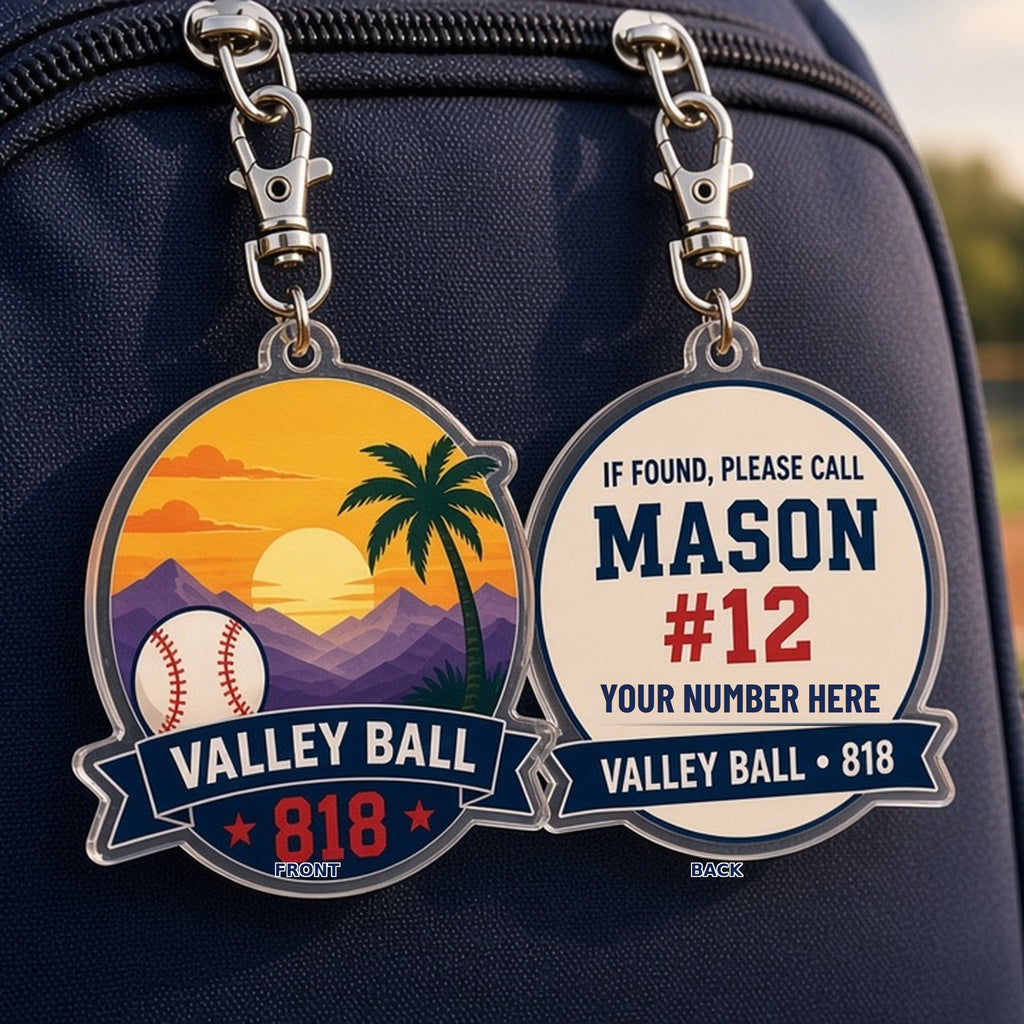 Valley Ball 818 lost and found keychain front and back labeled on a kids bat bag